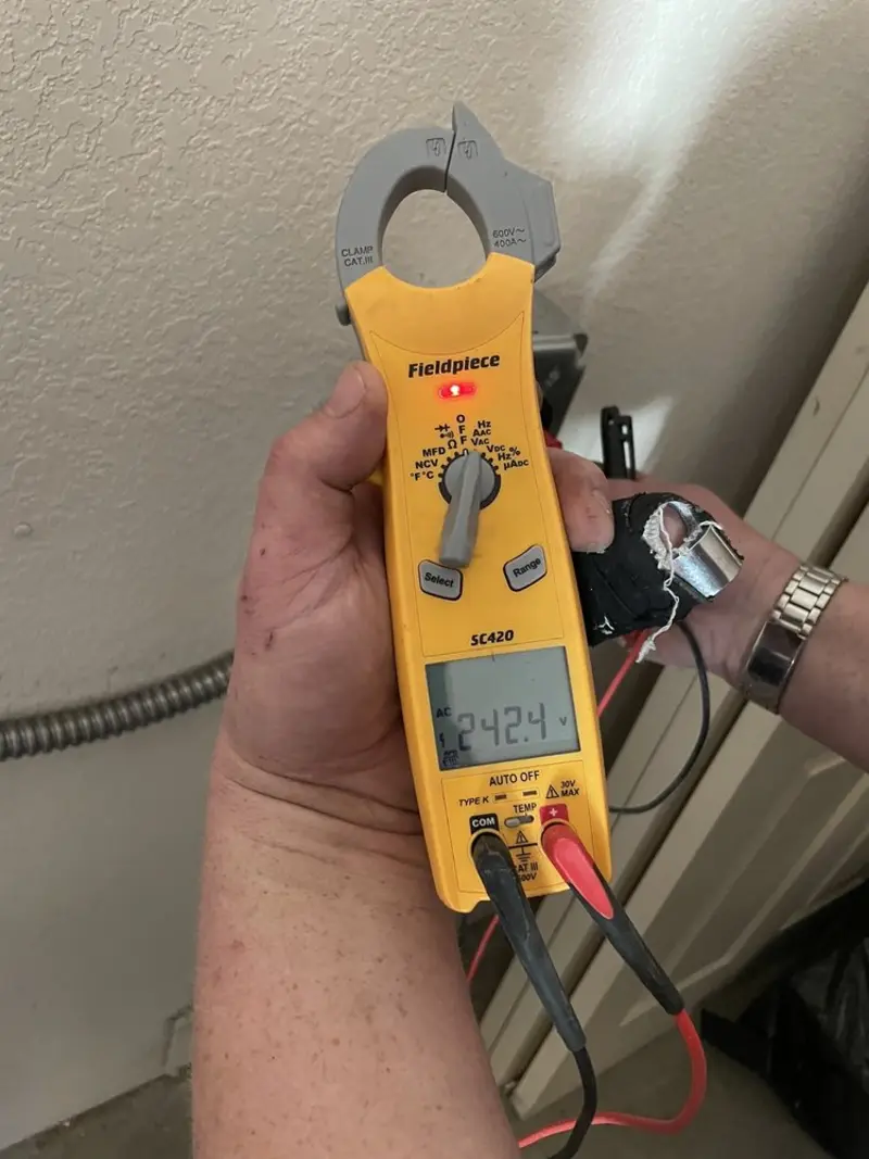 Voltage testing with clamp meter during Generator Installation in Elmira Heights